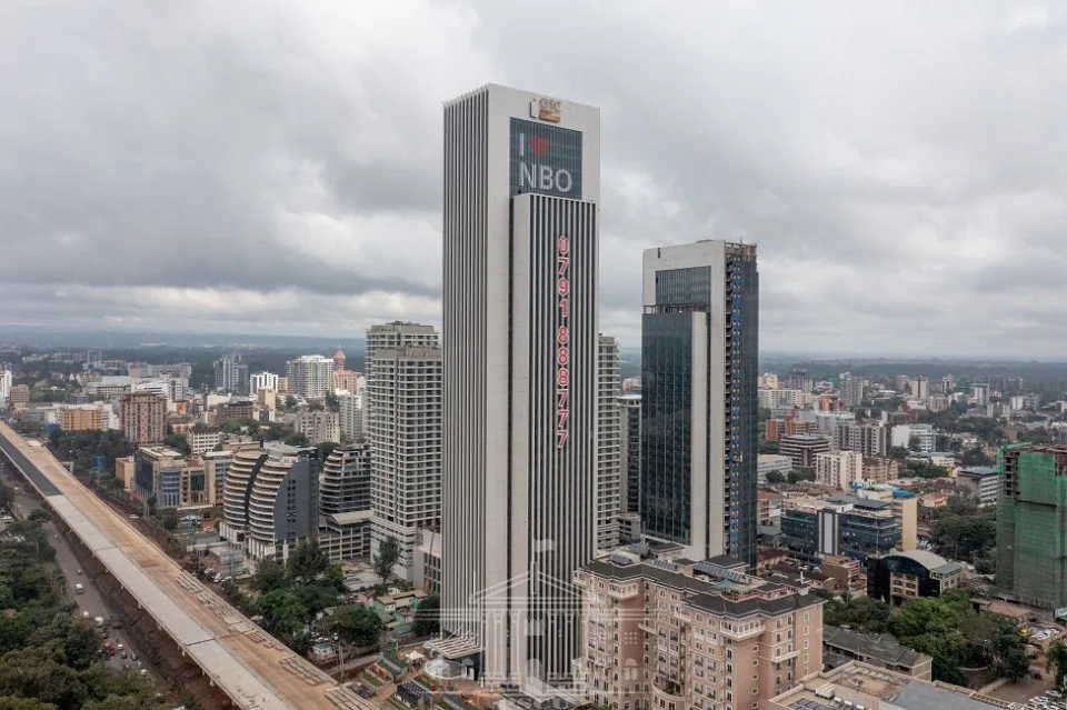 Tall office towers in Westlands, Nairobi, under a cloudy sky